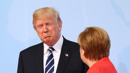 Bundeskanzlerin Angela Merkel begrüßt Donald Trump. Gerne würden die G20-Staaten mit ihm über Klimapolitik reden.